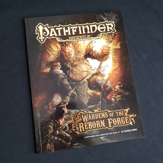 Image shows the front cover of the Wardens of the Reborn Forge book for the Pathfinder 1E roleplaying game