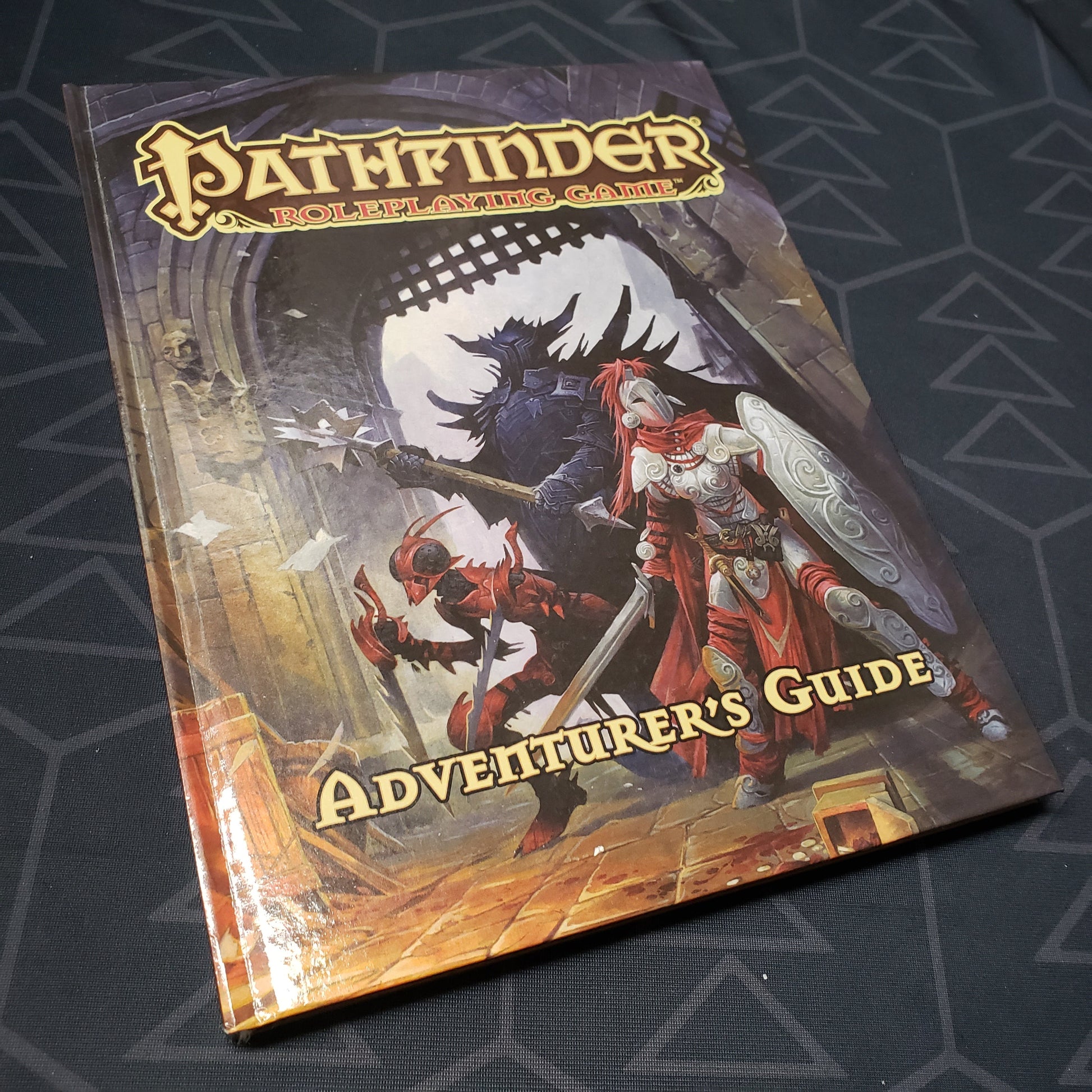 Image shows the front cover of the Adventurer's Guide book for the roleplaying game Pathfinder 1E