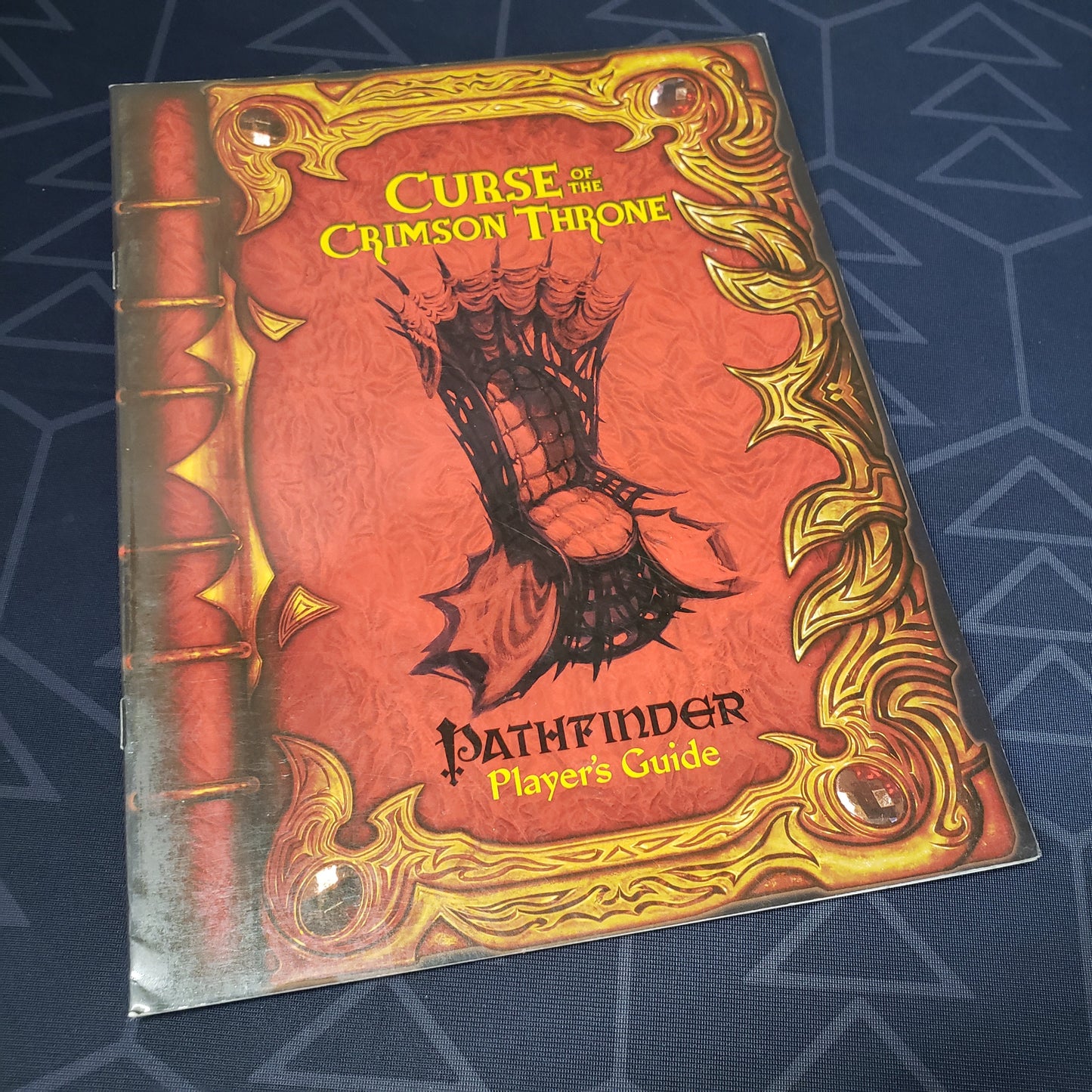 Image shows the front cover of the Curse of the Crimson Throne Player's Guide book for the roleplaying game Pathfinder: First Edition