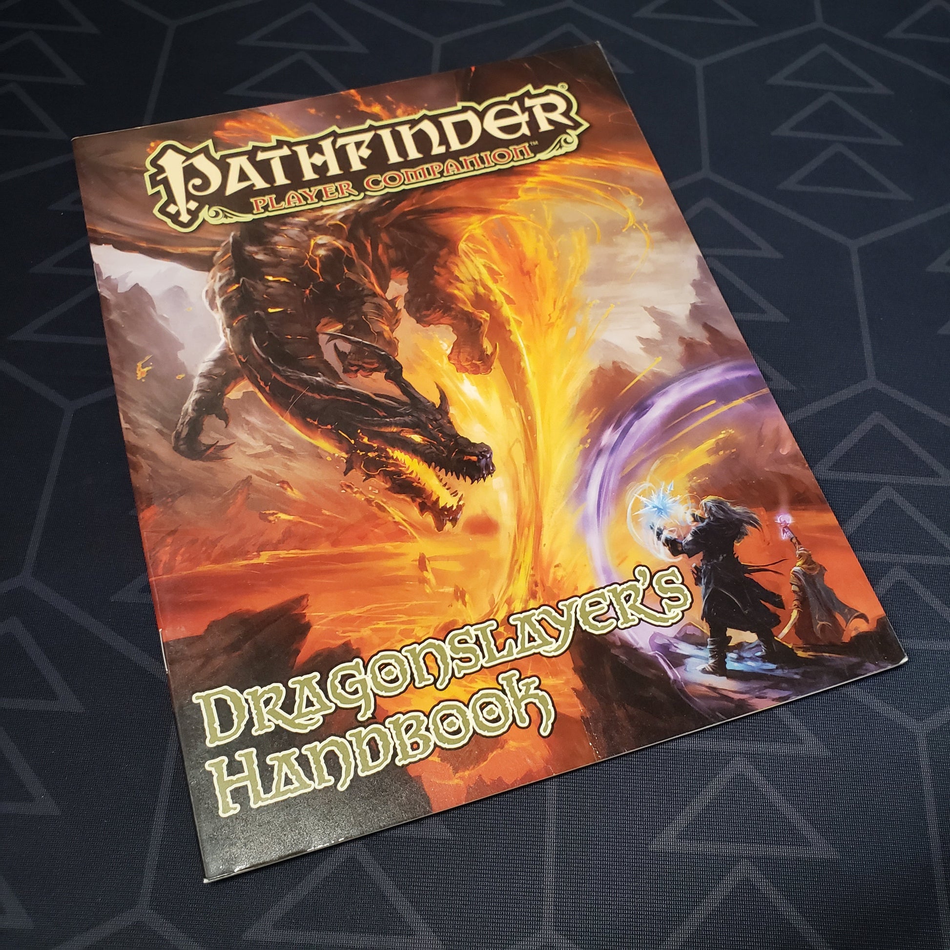 Image shows the front cover of the Dragonslayer's Handbook book for the roleplaying game Pathfinder: First Edition