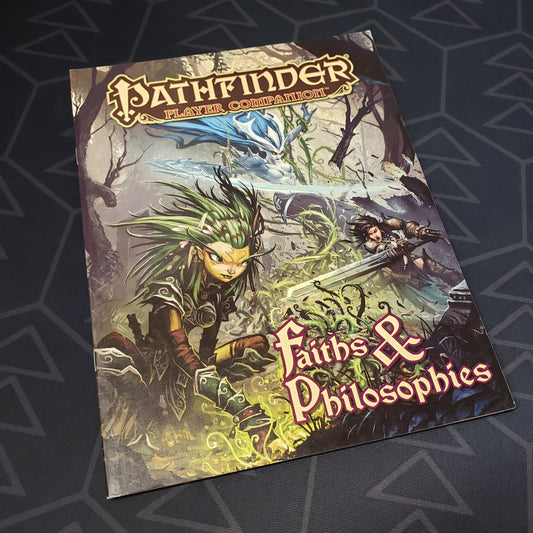 Image shows the front cover of the Faiths & Philosophies book for the roleplaying game Pathfinder: First Edition