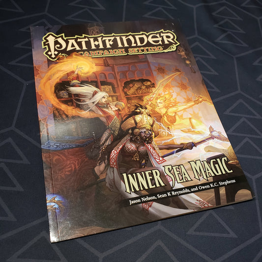 Image shows the front cover of the Inner Sea Magic book for the roleplaying game Pathfinder: First Edition
