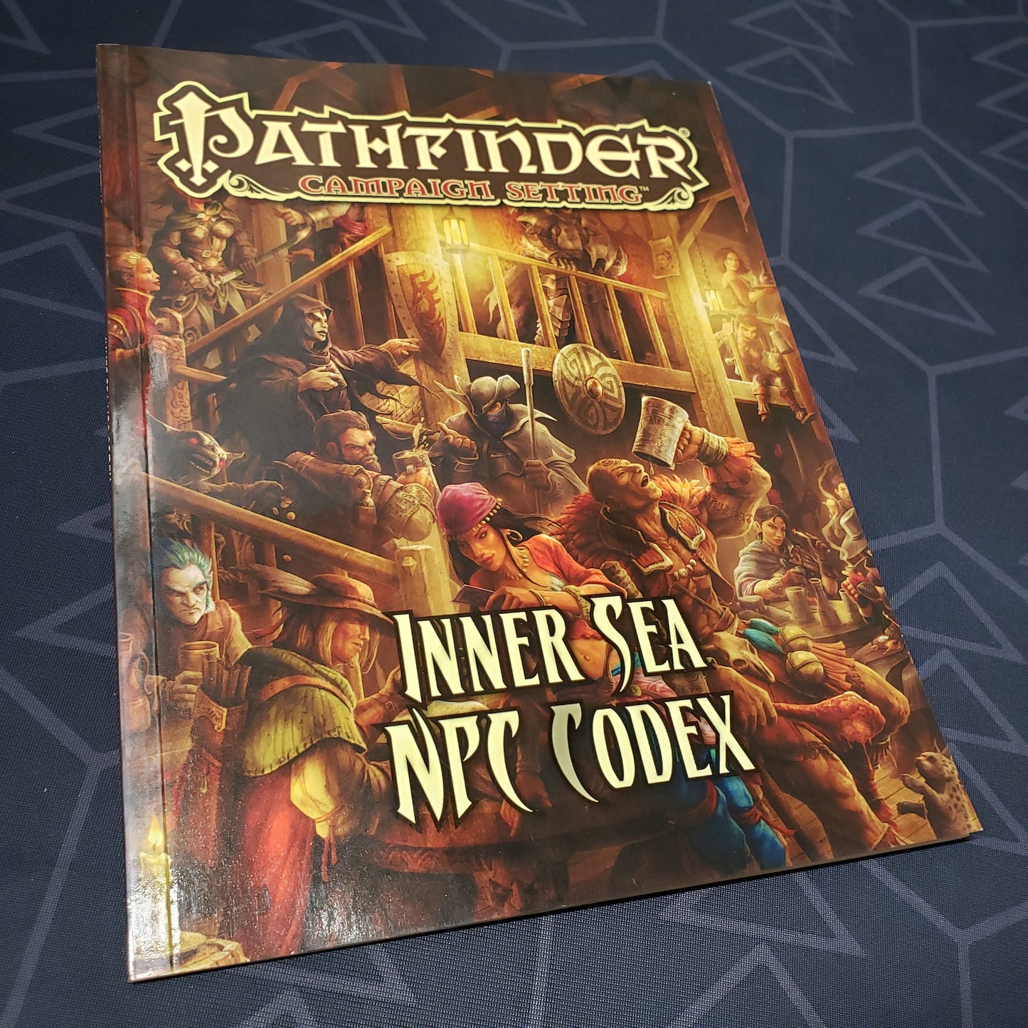 Image shows the front cover of the Inner Sea NPC Codex book for the roleplaying game Pathfinder 1E