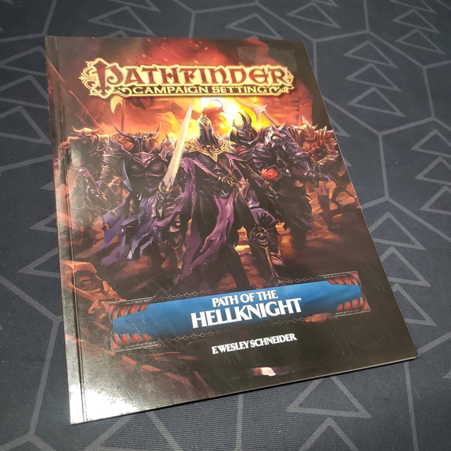 Image shows the front cover of the Path of the Hellknight book for the roleplaying game Pathfinder 1E