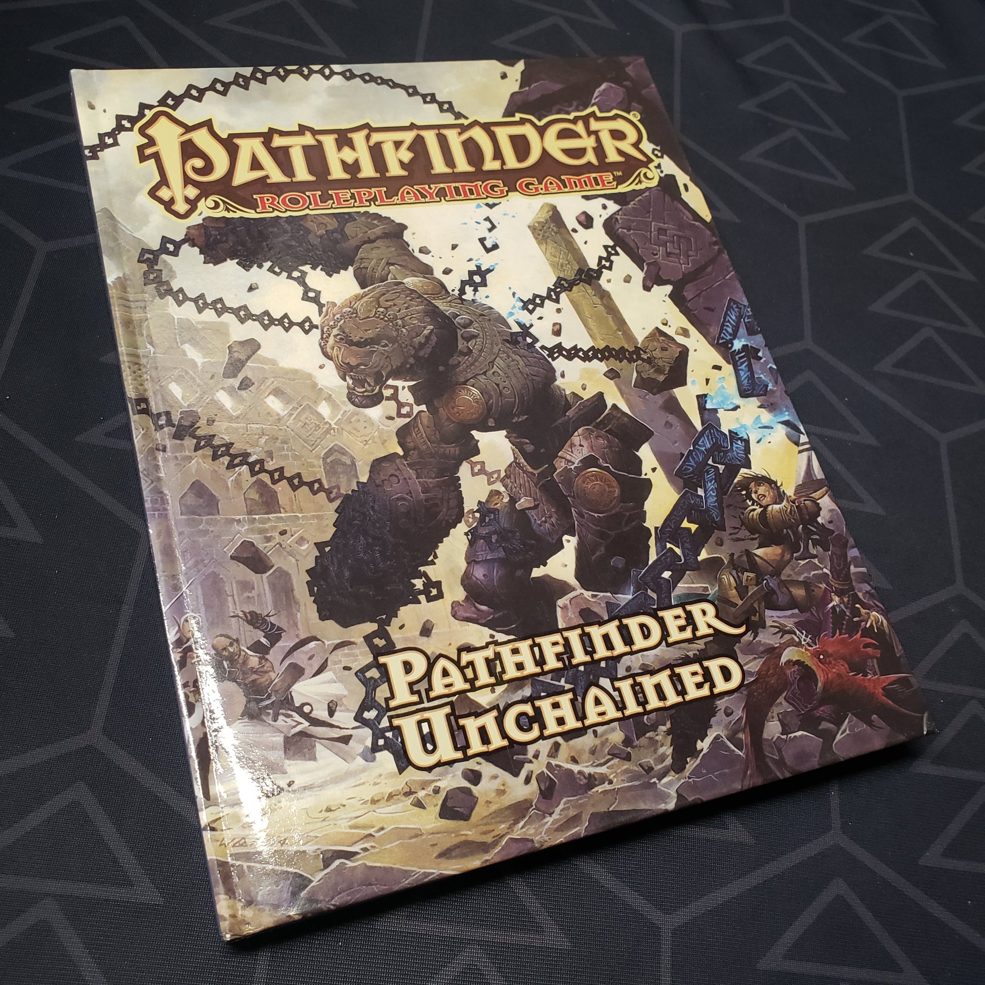 Image shows the front cover of the Pathfinder Unchained book for the roleplaying game Pathfinder 1E