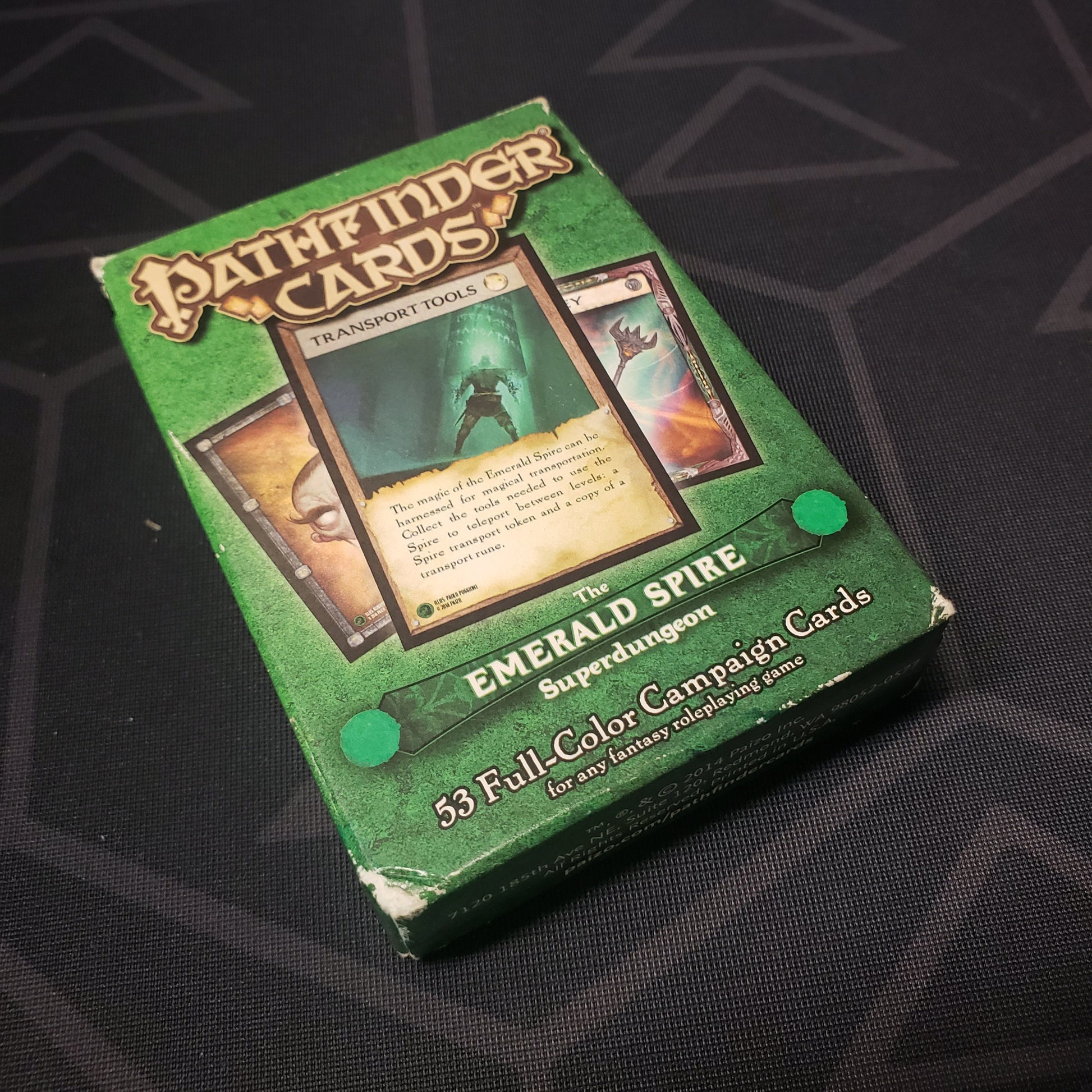 Image shows the front cover of the box for the Emerald Spire Superdungeon card deck for the roleplaying game Pathfinder 1E