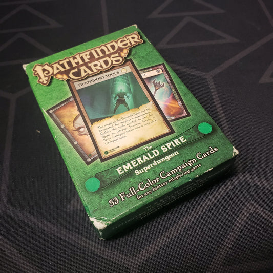 Image shows the front cover of the box for the Emerald Spire Superdungeon card deck for the roleplaying game Pathfinder 1E