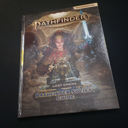 Image shows the front cover of the Lost Omens: Pathfinder Society Guide book for the Pathfinder 2E roleplaying game