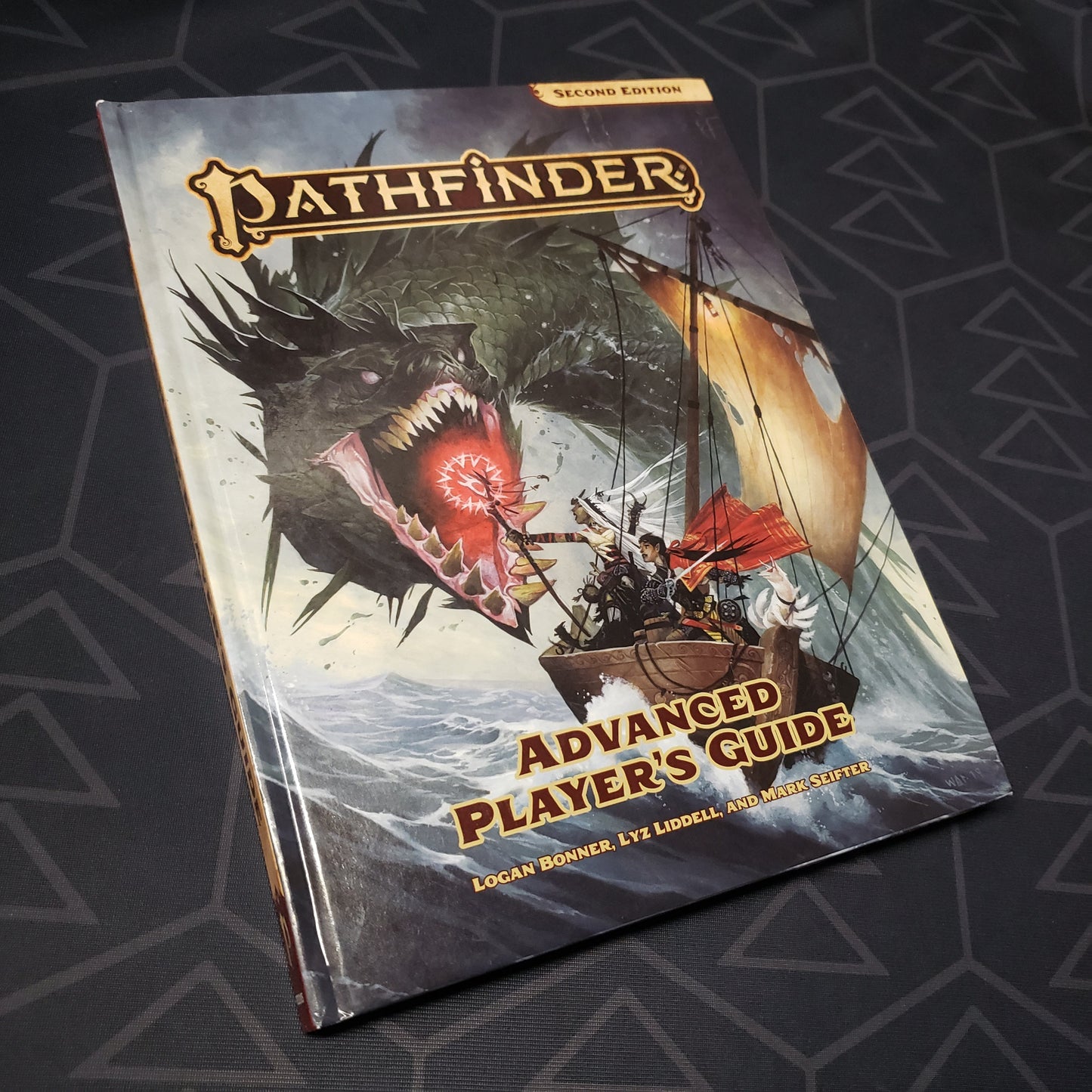Image shows the front cover of the Advanced Player's Guide book for the roleplaying game Pathfinder 2E