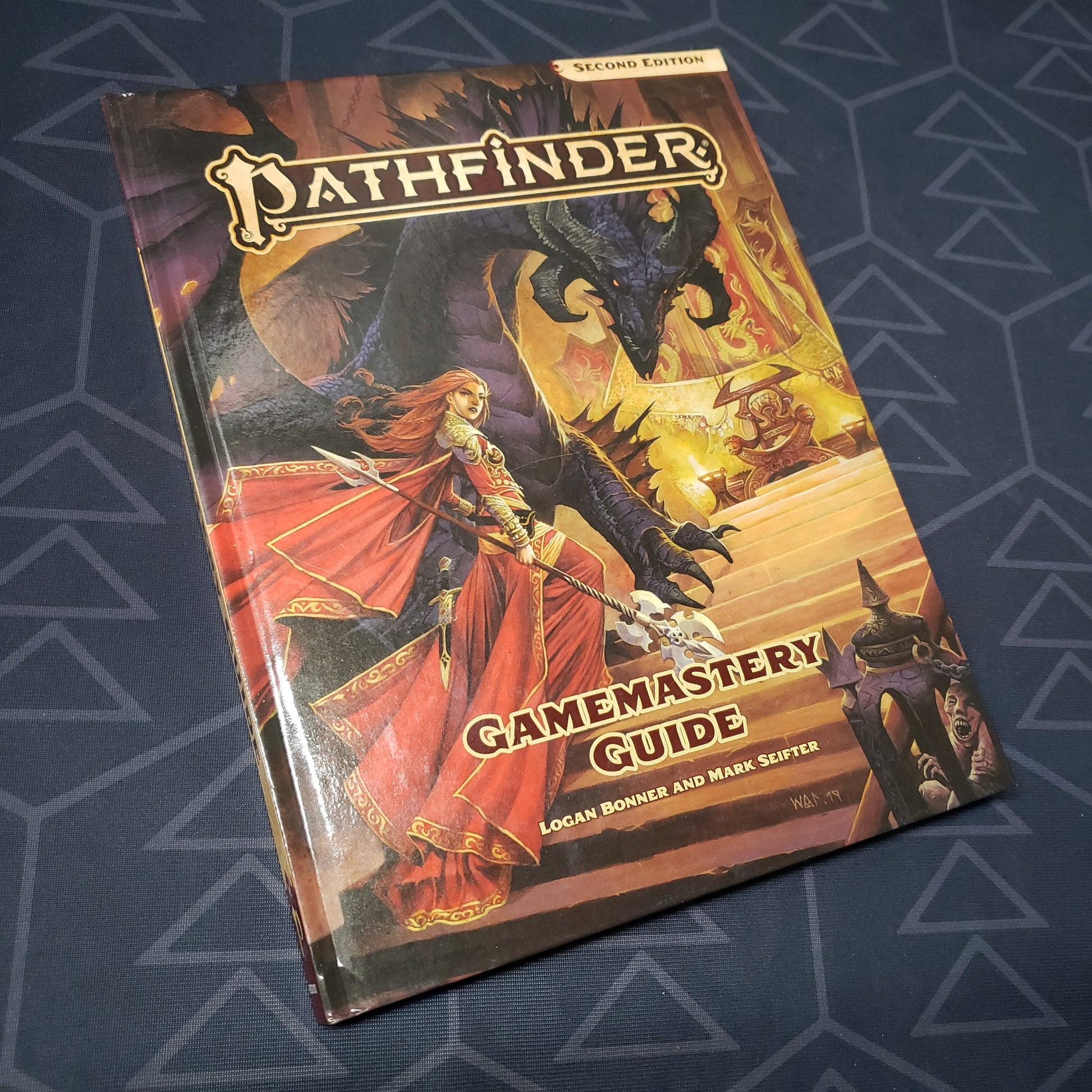 Image shows the front cover of the GameMastery Guide book for the roleplaying game Pathfinder 2E