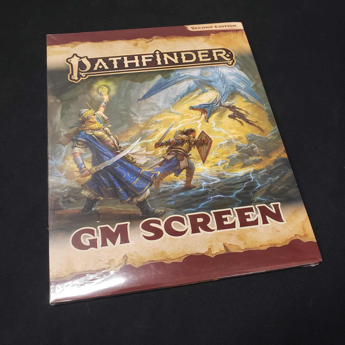 Image shows the front of the packaging for the GM Screen for the Pathfinder 2E roleplaying game