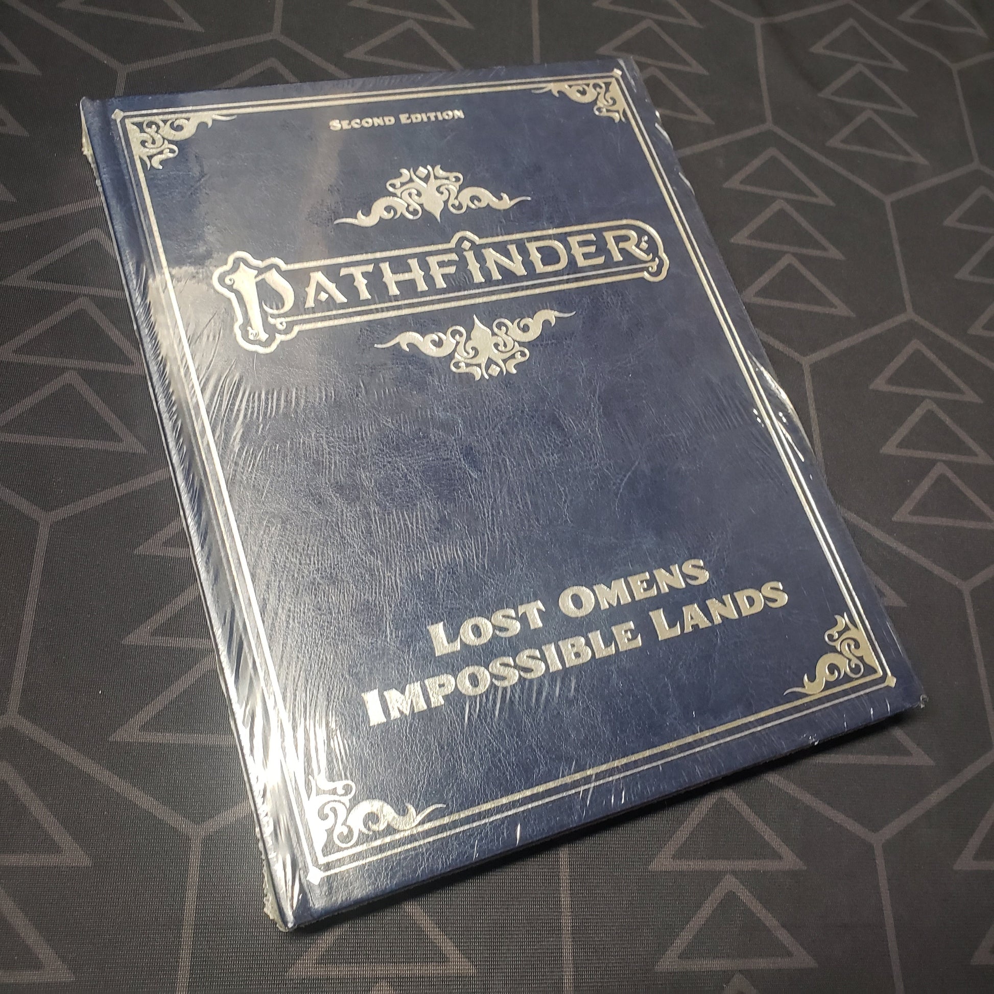 Image shows the front cover of the Lost Omens: Impossible Lands (Special Edition) book for the roleplaying game Pathfinder 2E