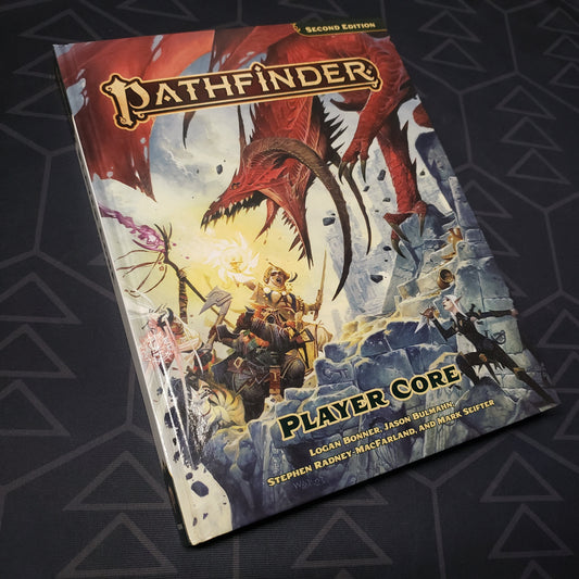 Image shows the front cover of the Player Core book for the roleplaying game Pathfinder 2E