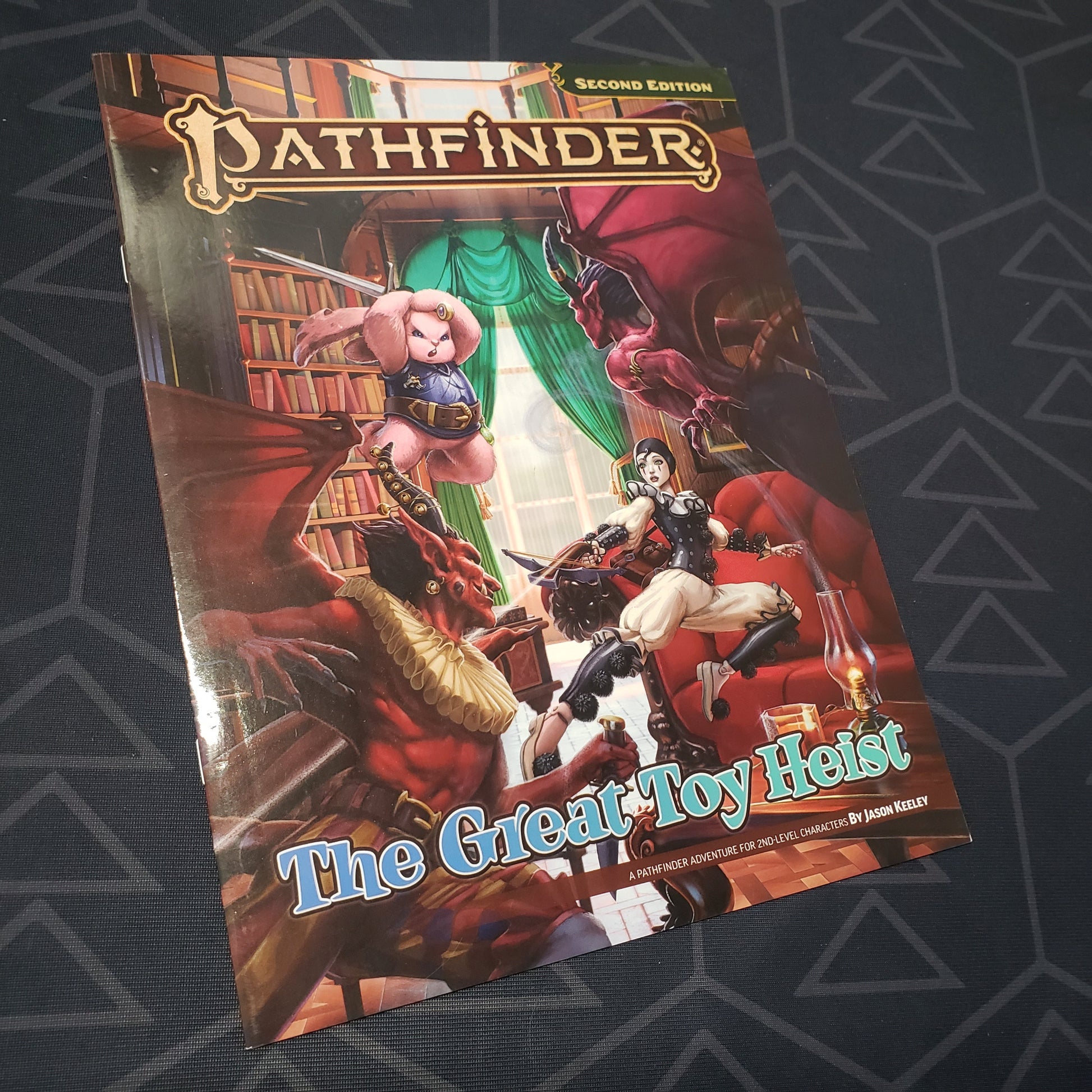Image shows the front cover of the Great Toy Heist book for the roleplaying game Pathfinder 2E