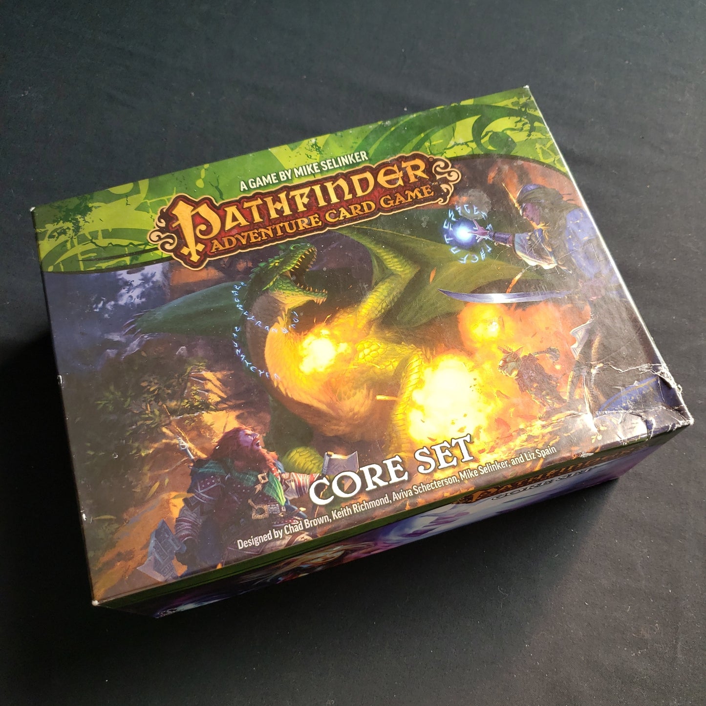 Image shows the front cover of the box of the Pathfinder Adventure Card Game: Core Set, with a damaged lower right corner