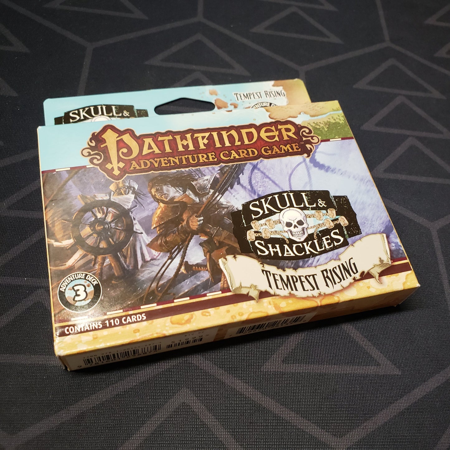 Image shows the front cover of the box of the Skull & Shackles Deck #3: Tempest Rising expansion for the Pathfinder Adventure Card Game
