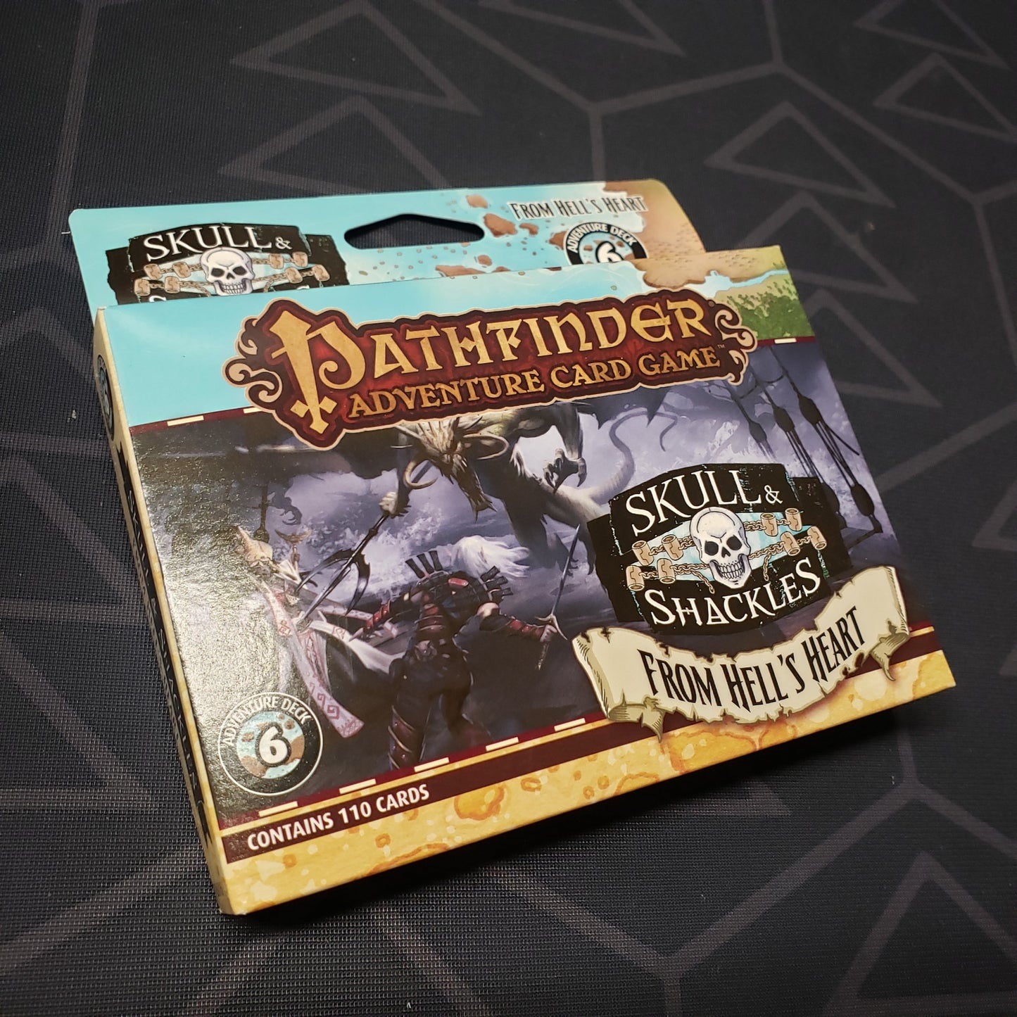 Image shows the front cover of the box of the Skull & Shackles Deck #6: From Hell's Heart expansion for the Pathfinder Adventure Card Game