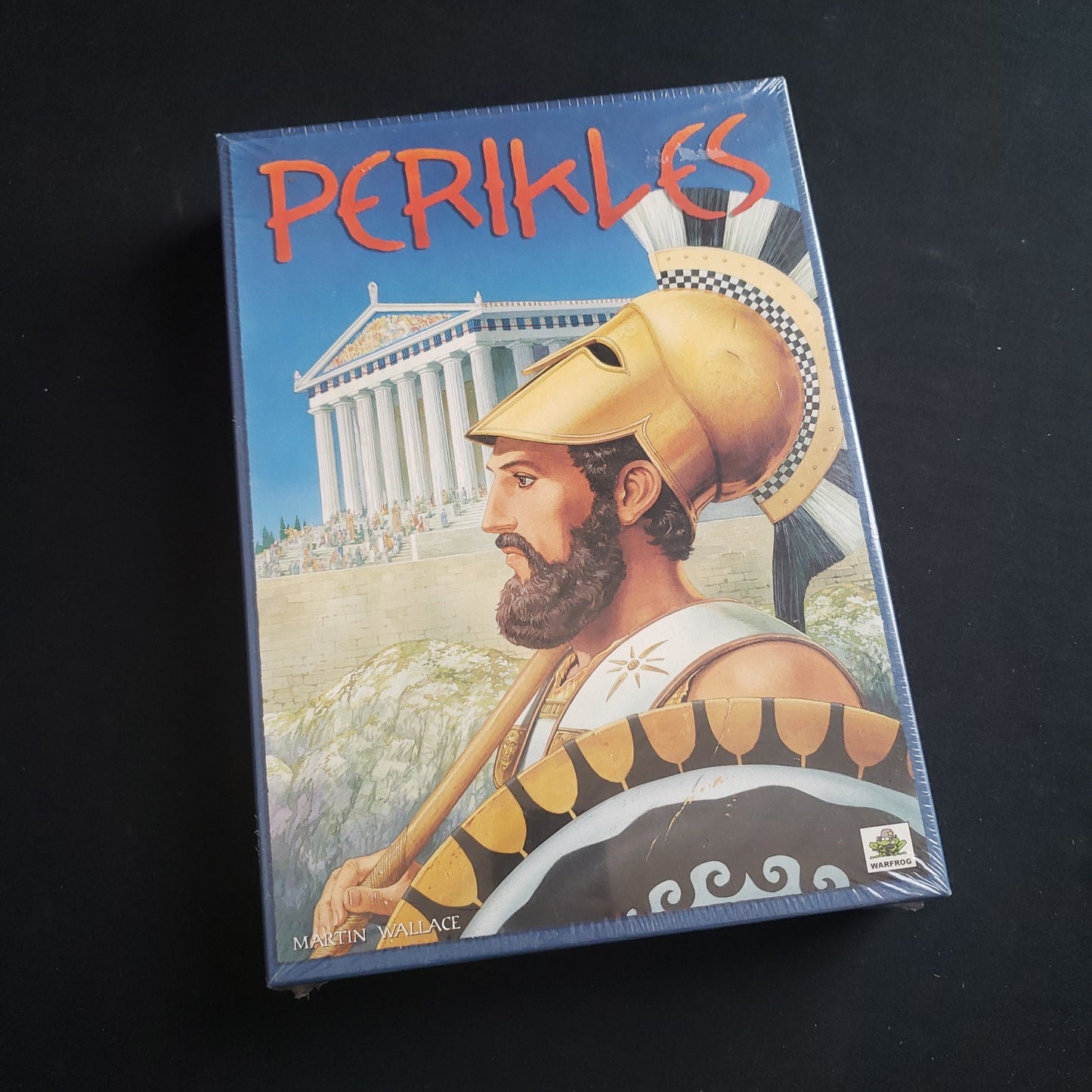 Image shows the front cover of the box of the Perikles board game