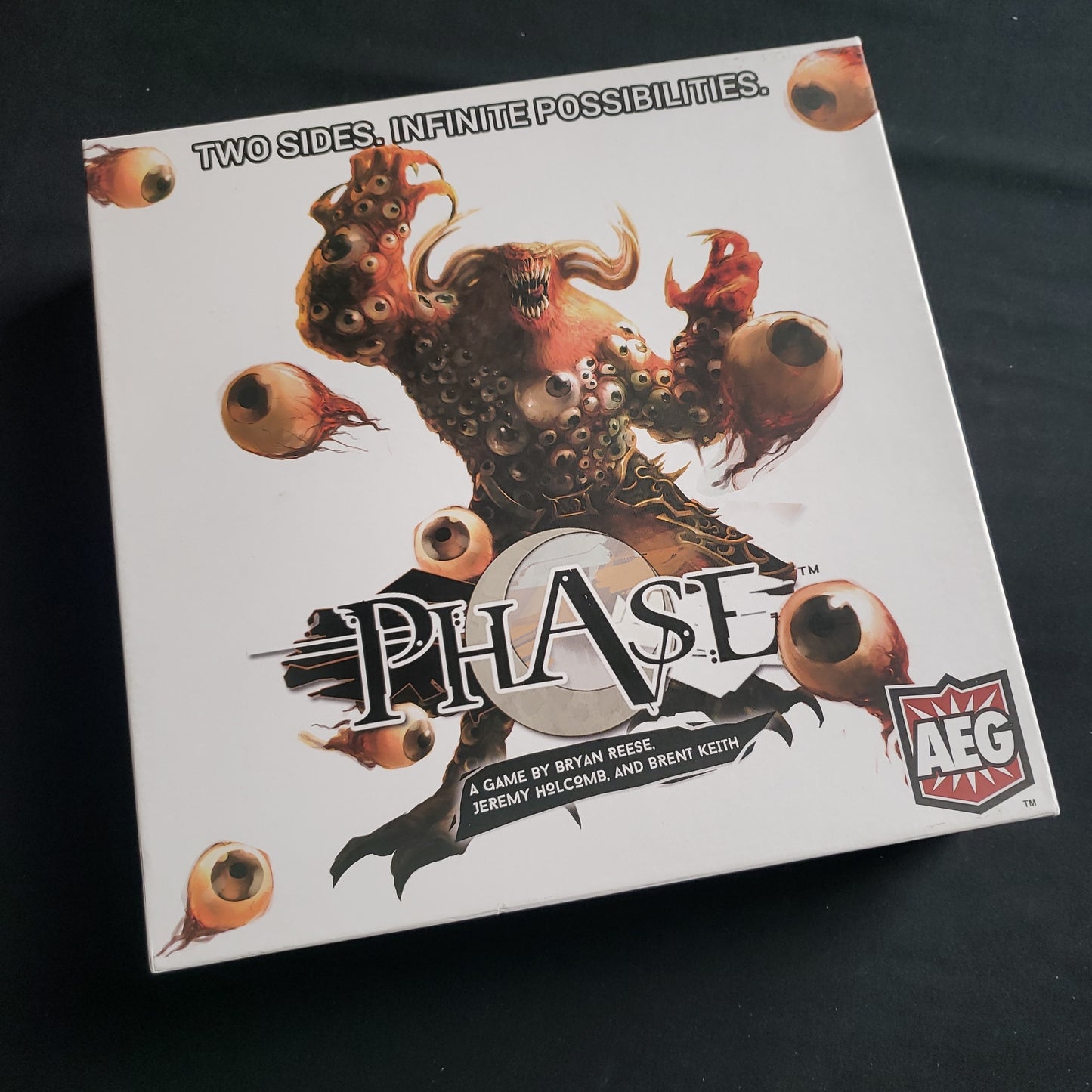 Image shows the front cover of the box of the Phase card game