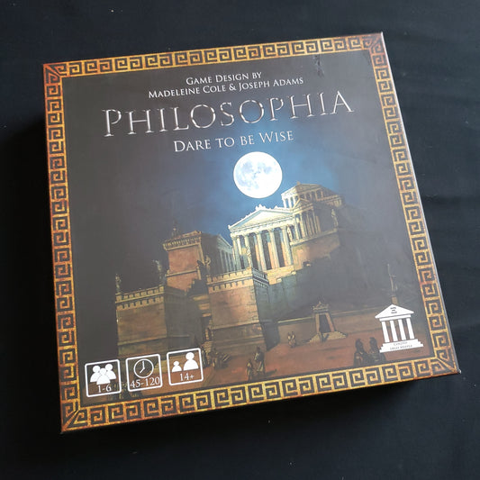 Image shows the front cover of the box of the Philosophia: Dare to Be Wise board game