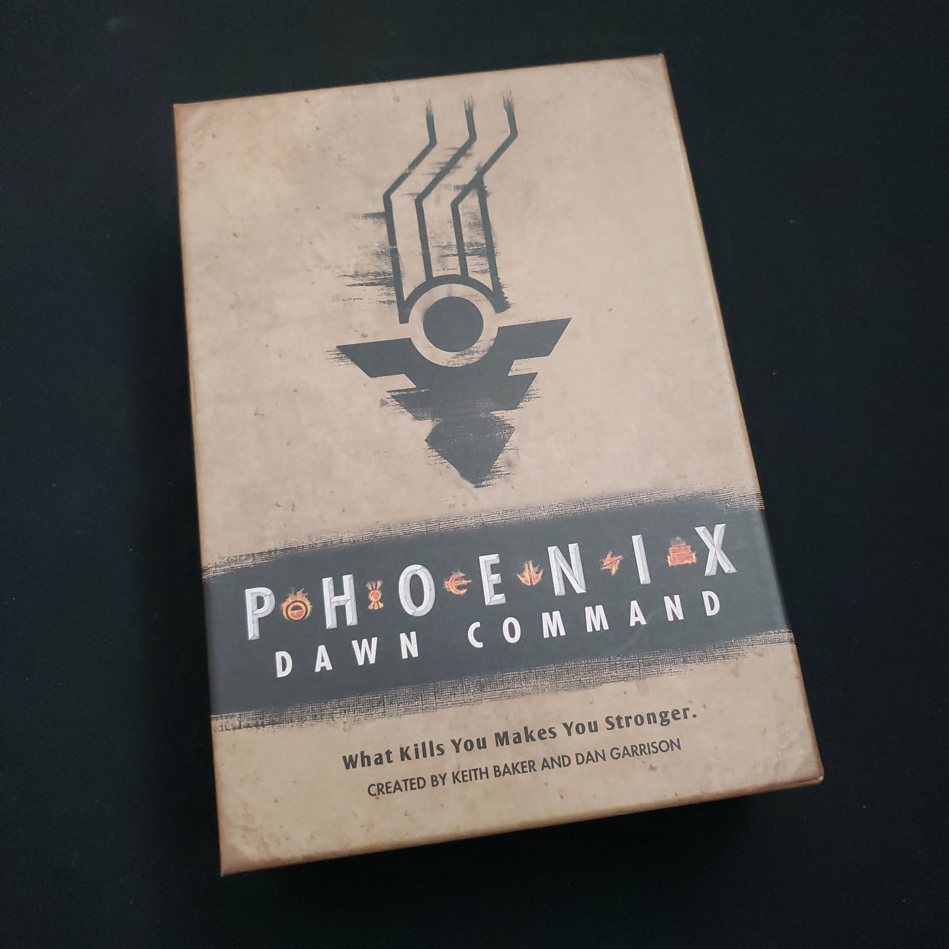 Image shows the front cover of the Phoenix: Dawn Command roleplaying game boxed set