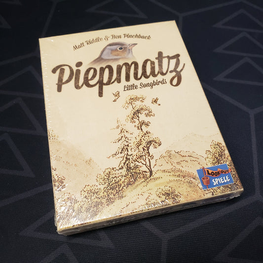 Image shows the front cover of the box of the Piepmatz: Little Songbirds card game