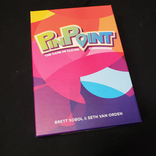 Image shows the front cover of the box of the Pinpoint board game