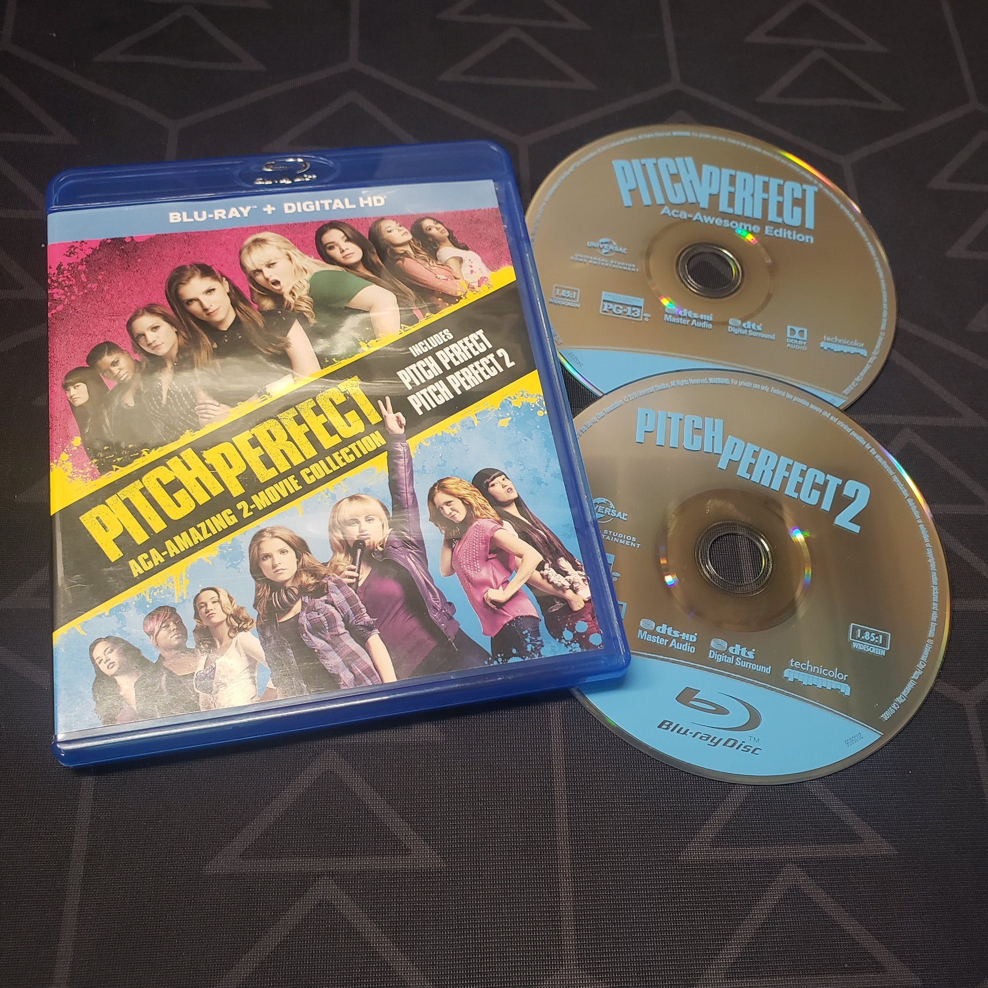 Image shows the case & two discs for the Pitch Perfect: Aca-Amazing 2-Movie Collection on Blu-Ray