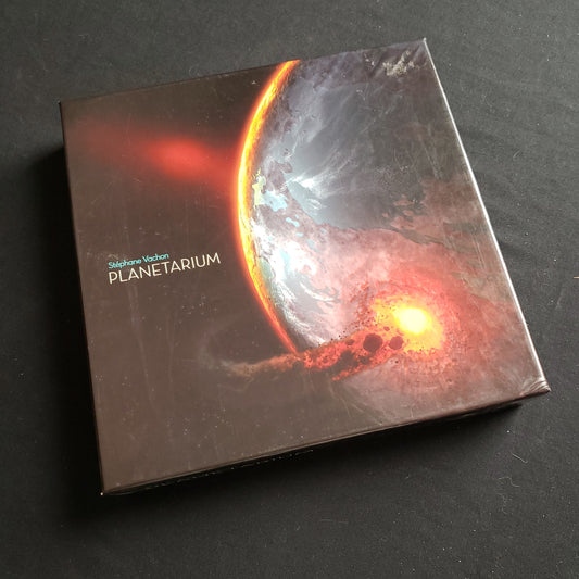 Image shows the front cover of the box of the Planetarium board game