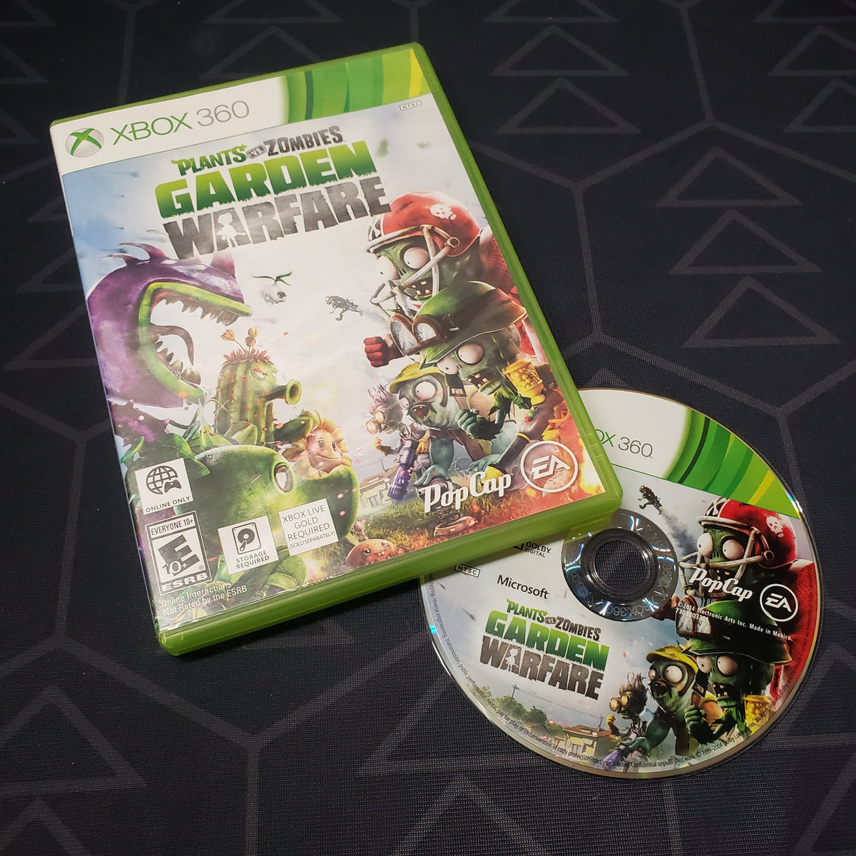 Image shows the case and disc for the video game Plants vs. Zombies: Garden Warfare for Xbox 360