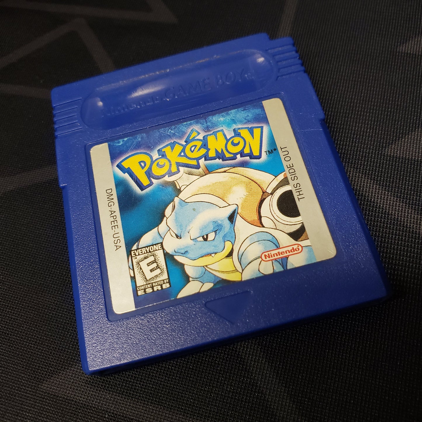 Image shows the outside of the cartridge for the game Pokemon Blue for Nintendo Game Boy