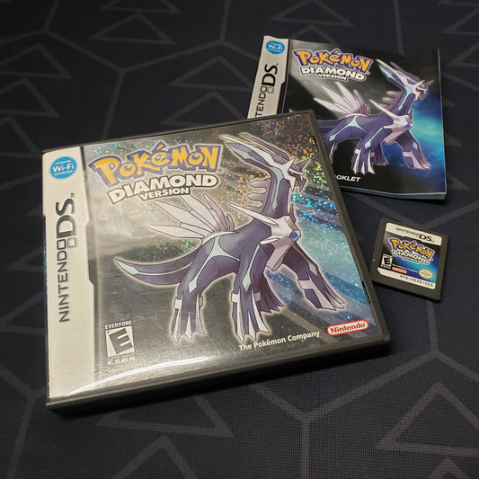 Image shows the case, manual and cartridge for the video game Pokemon Diamond for Nintendo DS