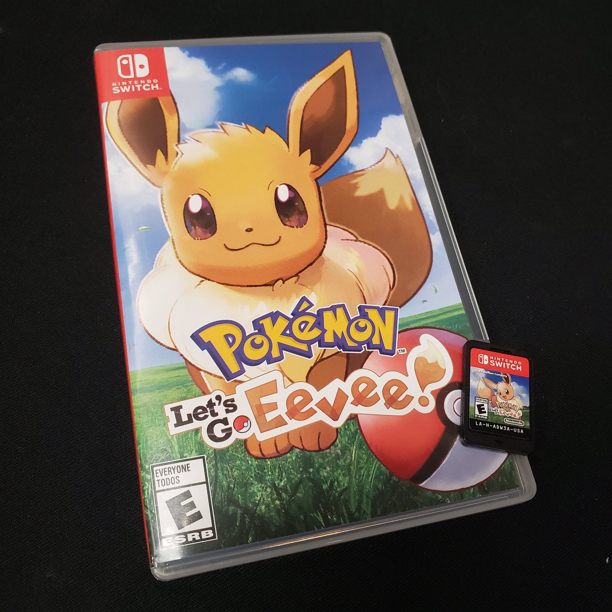 Image shows the case & cartridge for the video game Pokemon: Let's Go, Eevee! for Nintendo Switch