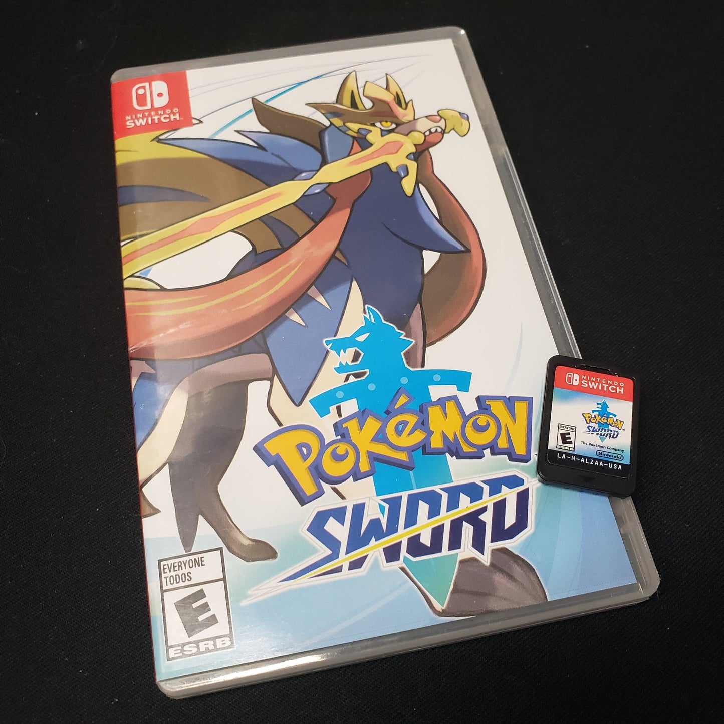 Image shows the case & cartridge for the video game Pokemon Sword for Nintendo Switch