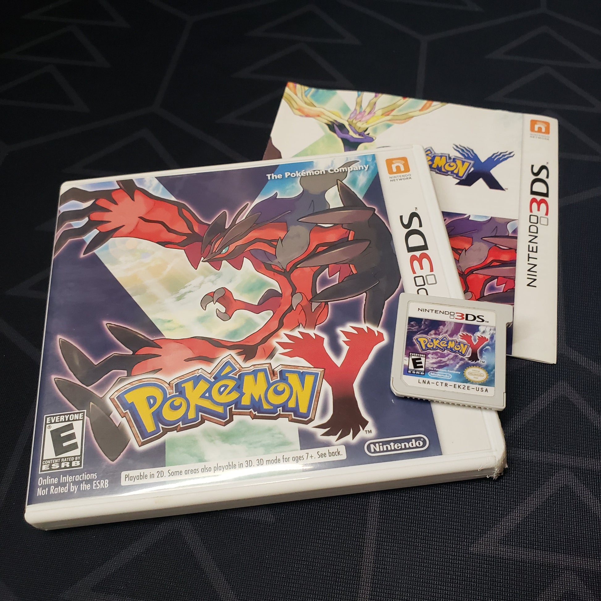 Image shows the case, manual & cartridge for the game Pokemon Y for Nintendo 3Ds