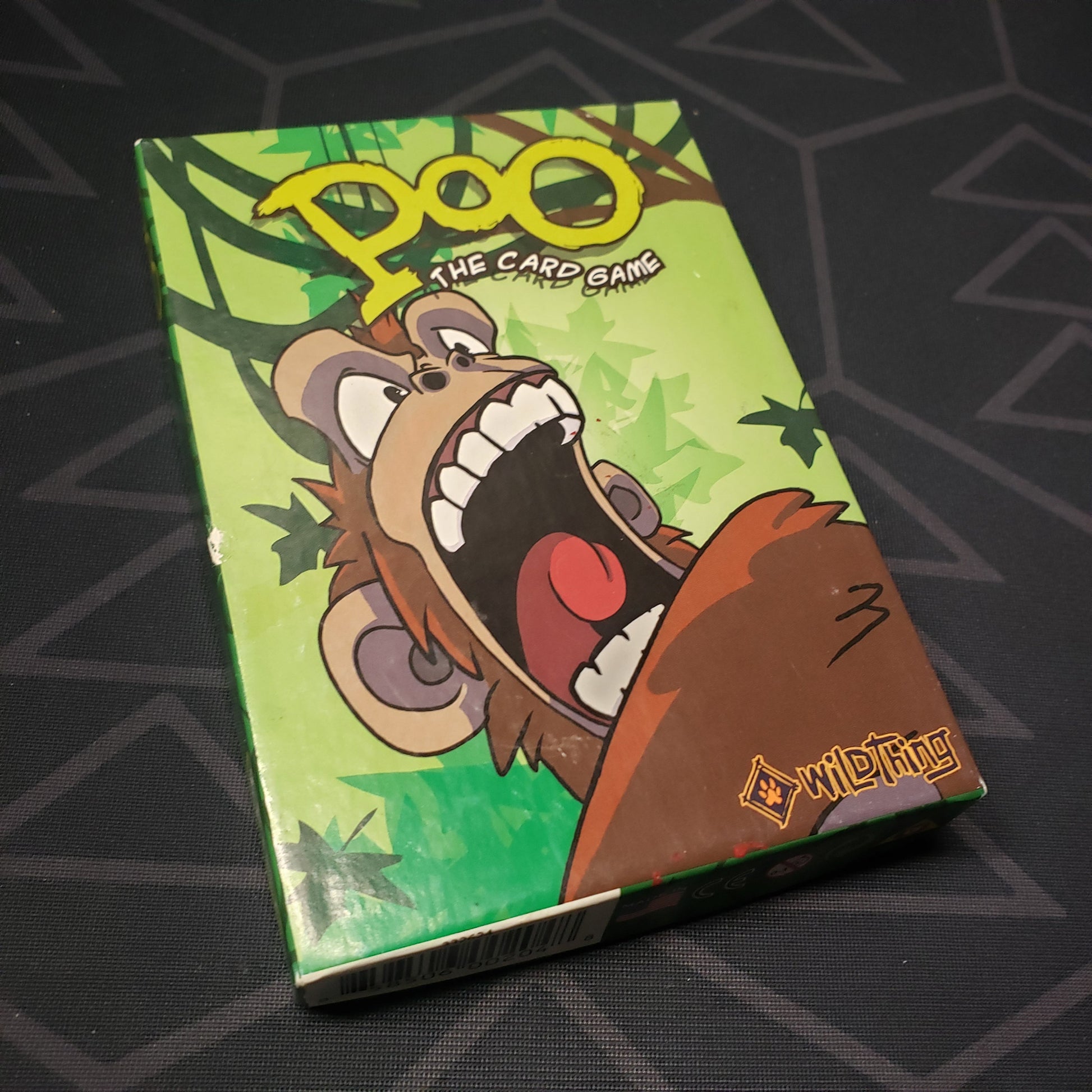 Image shows the front cover of the box for the card game Poo: The Card Game