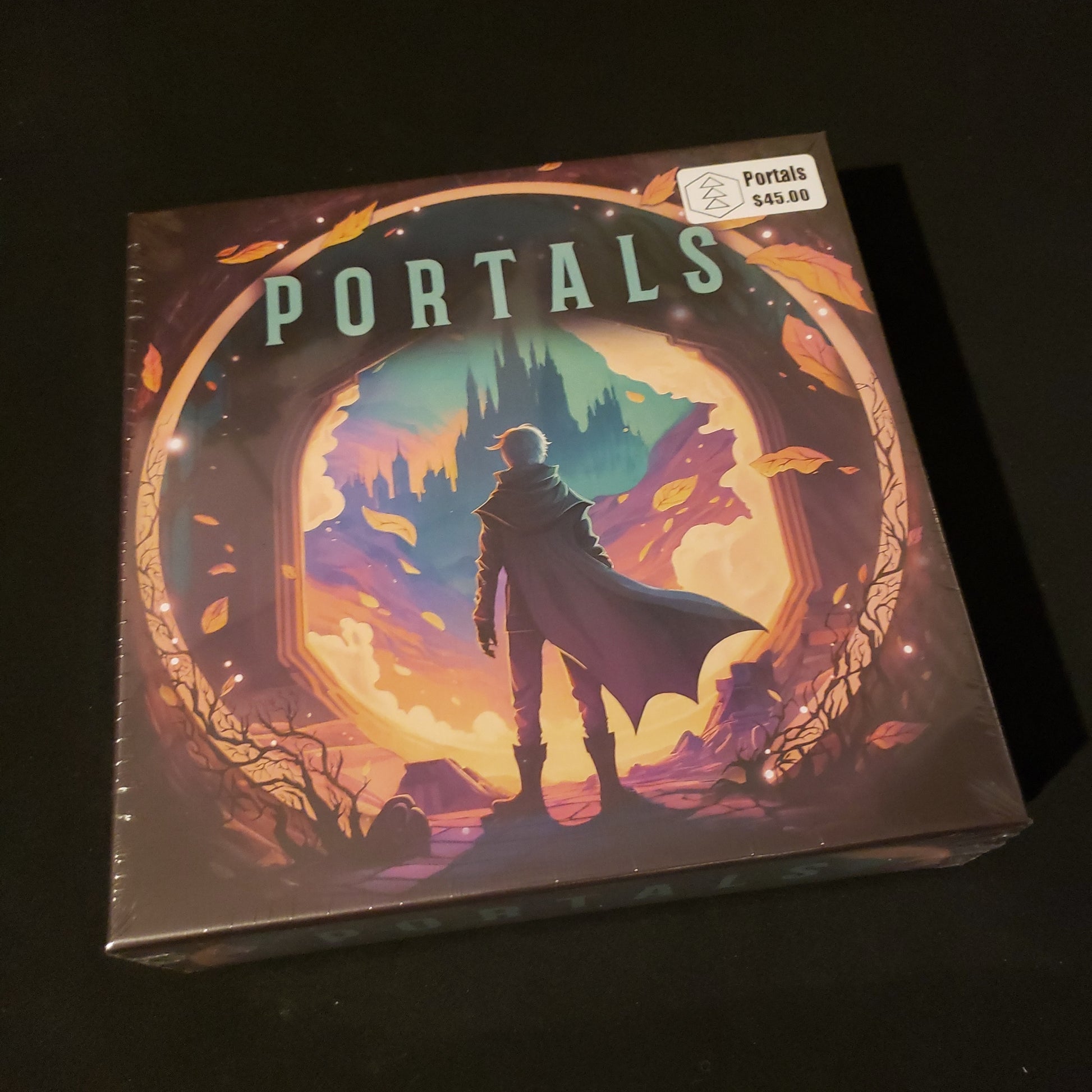 Image shows the front cover of the box of the Portals board game