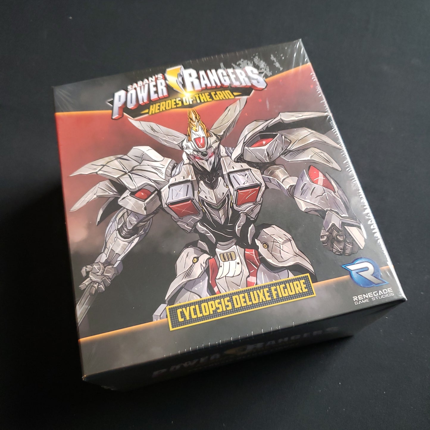 Image shows the front of the box for the Cyclopsis Deluxe Figure Expansion for the Power Rangers: Heroes of the Grid board game