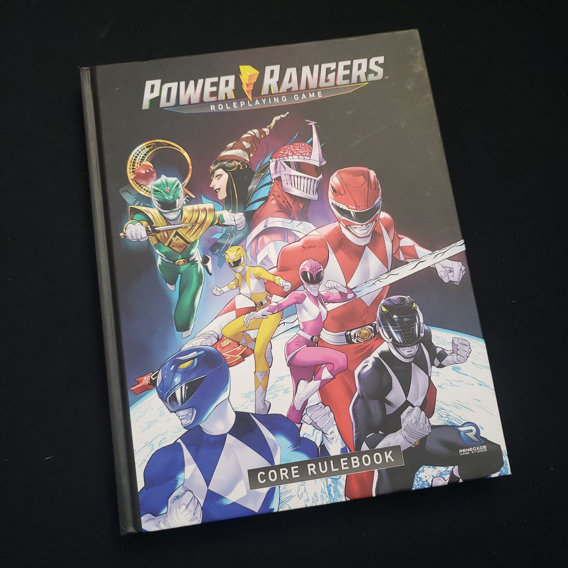 Image shows the front cover of the core rulebook for the Power Rangers roleplaying game