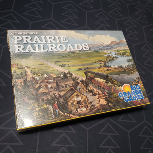 Image shows the front cover of the box for the Prairie Railroads board game
