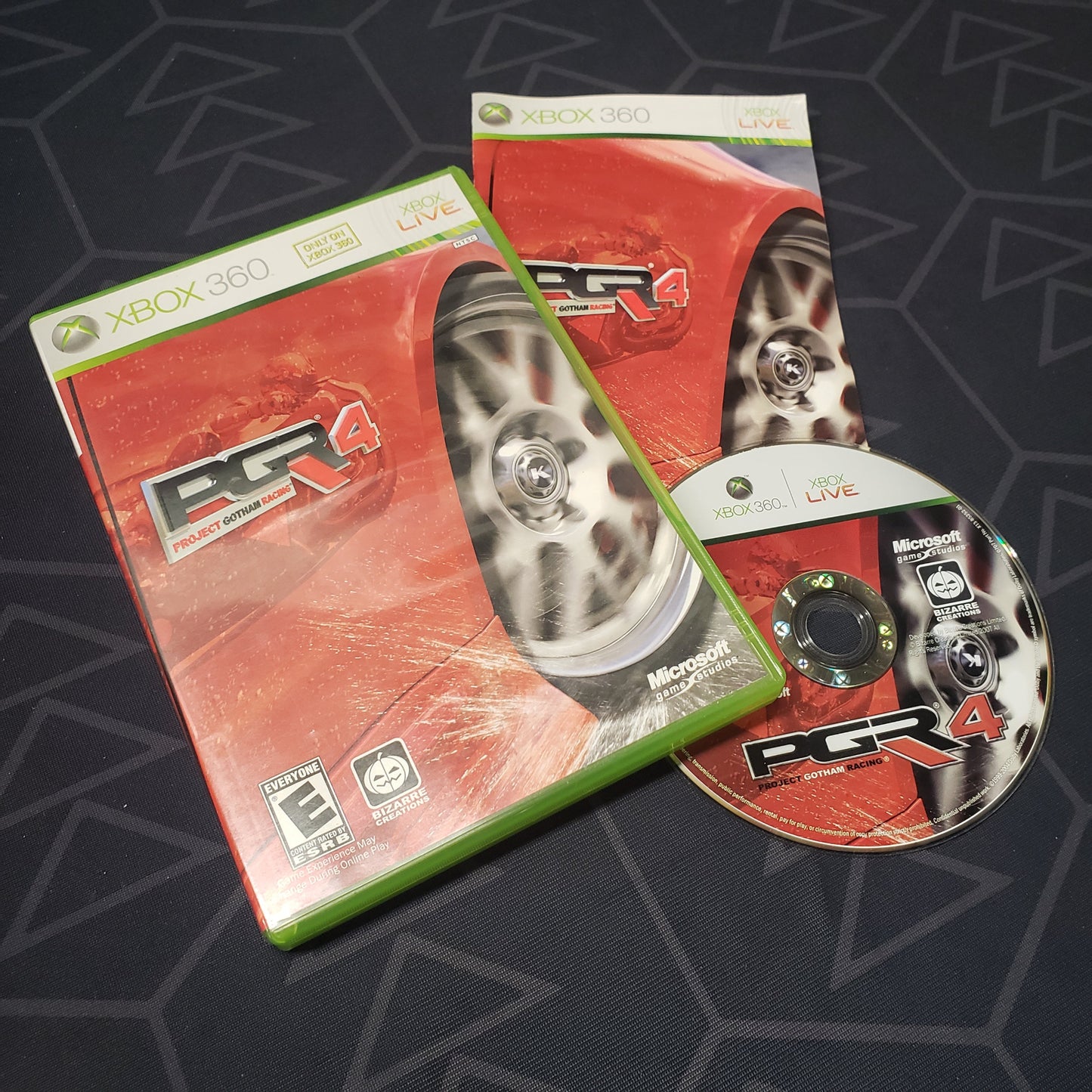 Image shows the case, manual and disc for the video game Project Gotham Racing 4 for Xbox 360