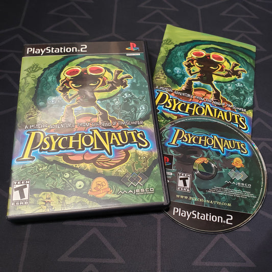 Image shows the case, manual and disc for the video game Psychonauts for Playstation 2