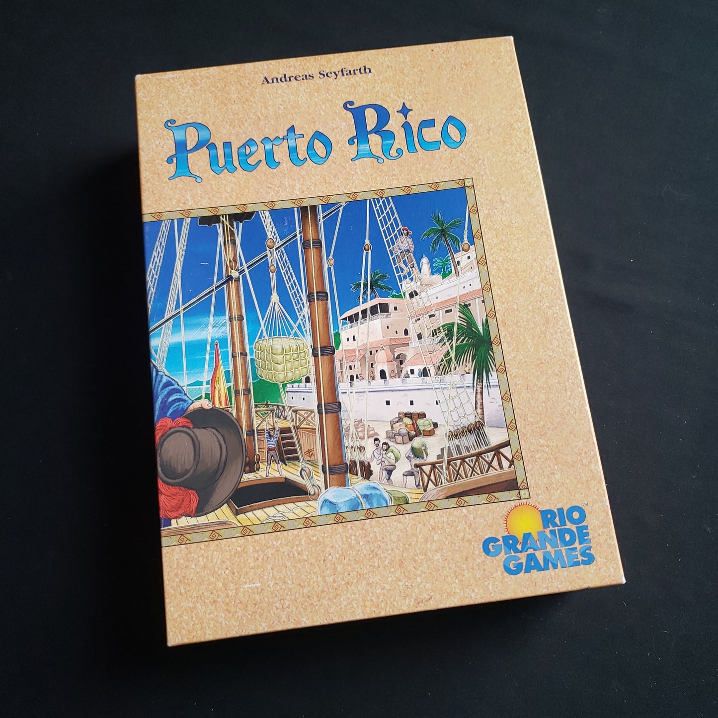 Image shows the front cover of the box of the Puerto Rico board game