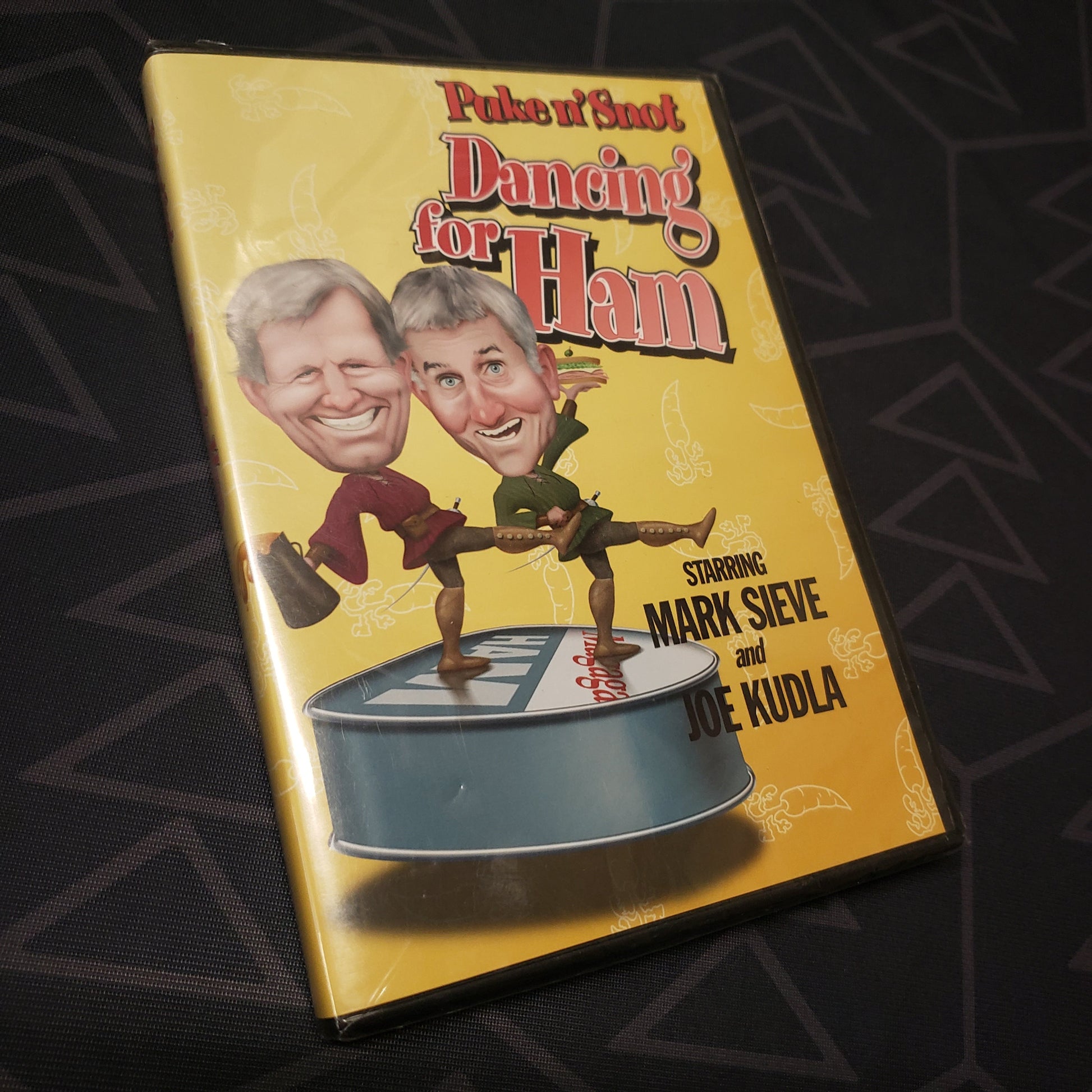 Image shows the front of the case for the movie Puke n' Snot: Dancing for Ham on DVD