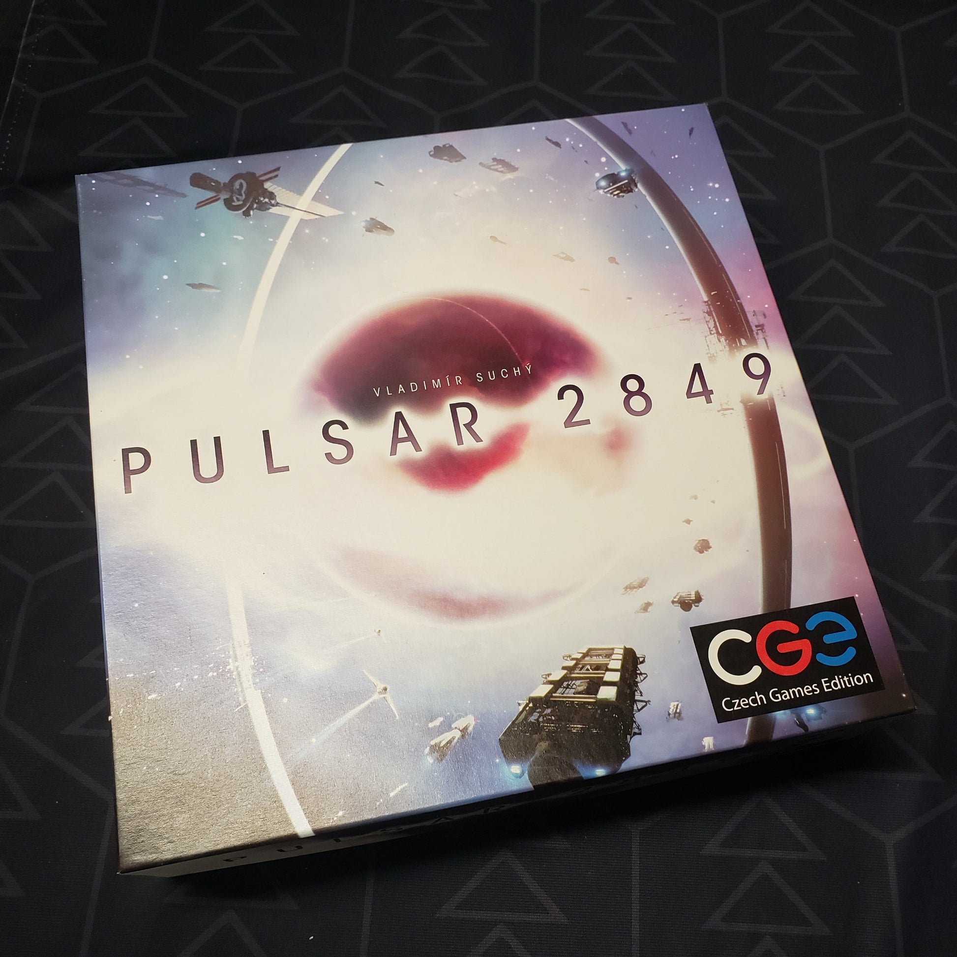 Image shows the front cover of the box for the Pulsar 2849 board game