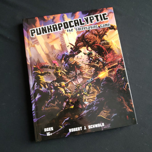 Image shows the front cover of the Core Rulebook for the PunkApocalyptic roleplaying game