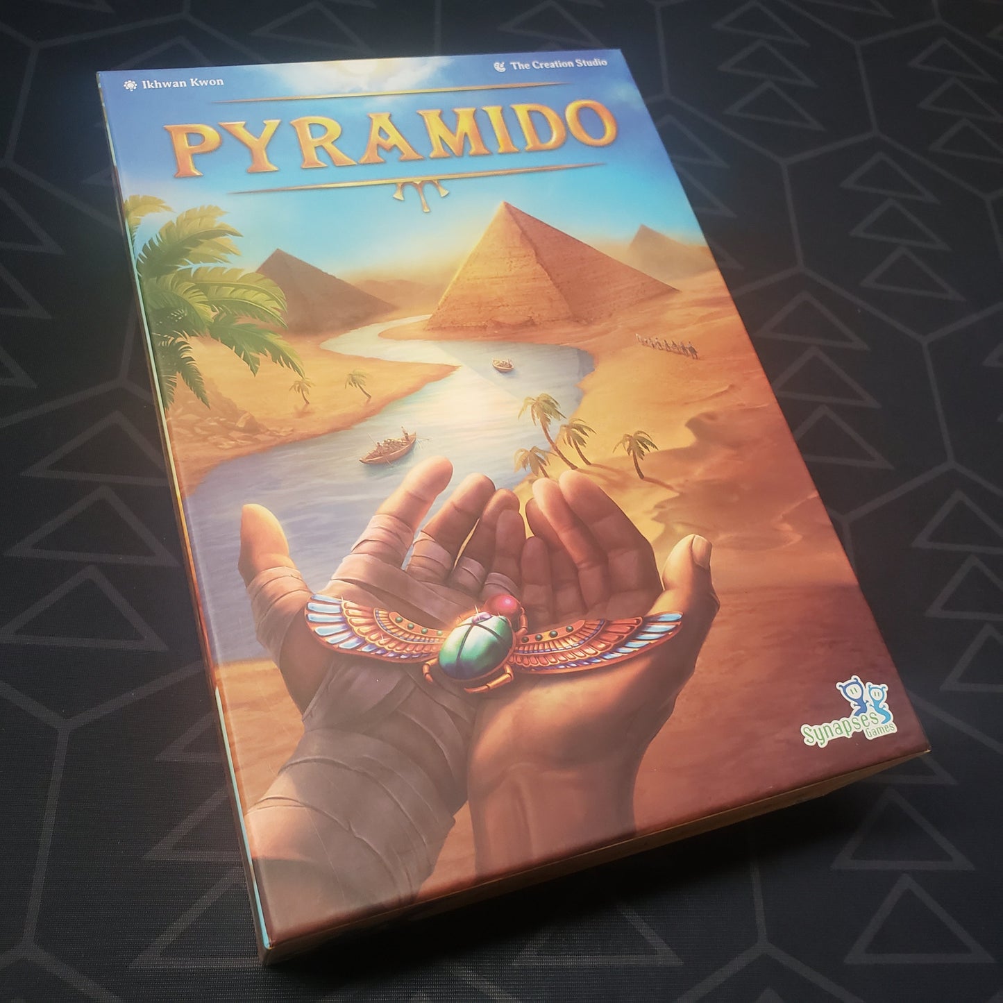 Image shows the front cover of the box for the Pyramido board game