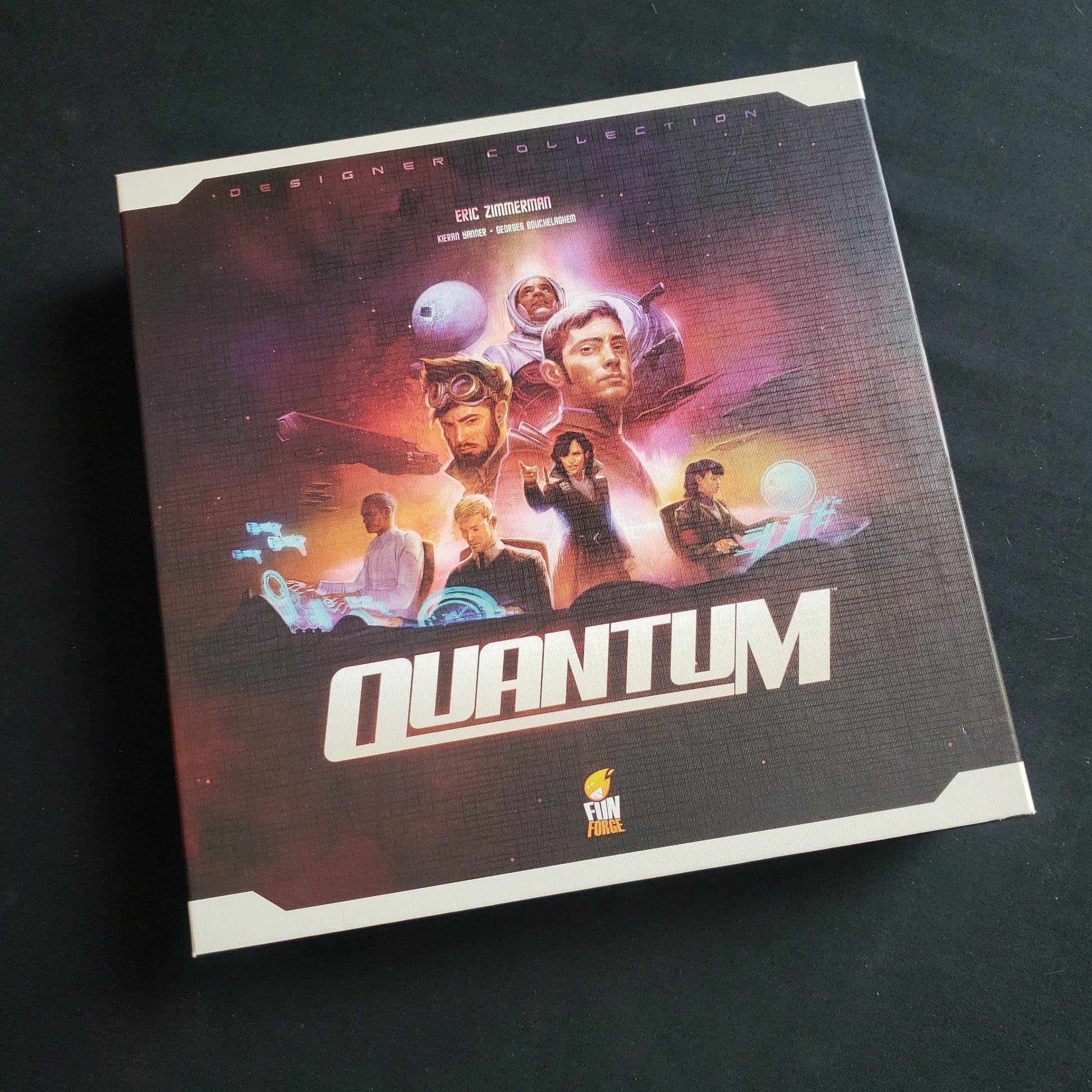 Image shows the front cover of the box of the Quantum board game