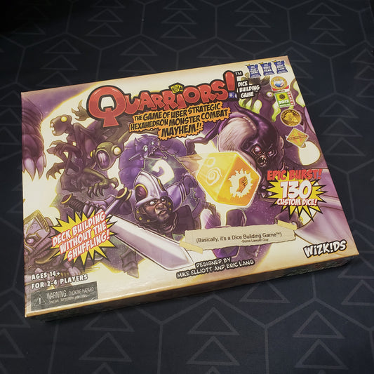 Image shows the front cover of the box of the Qaurriors board game
