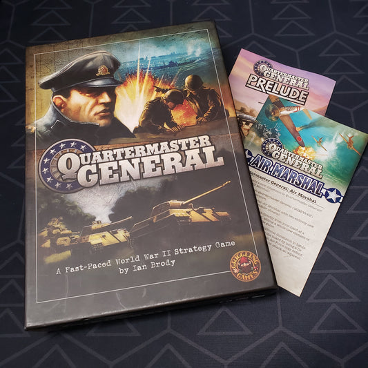 Image shows the front cover of the box of the Quartermaster General board game, with the instructions for the Air Marshal and Prelude expansions tucked underneath the box
